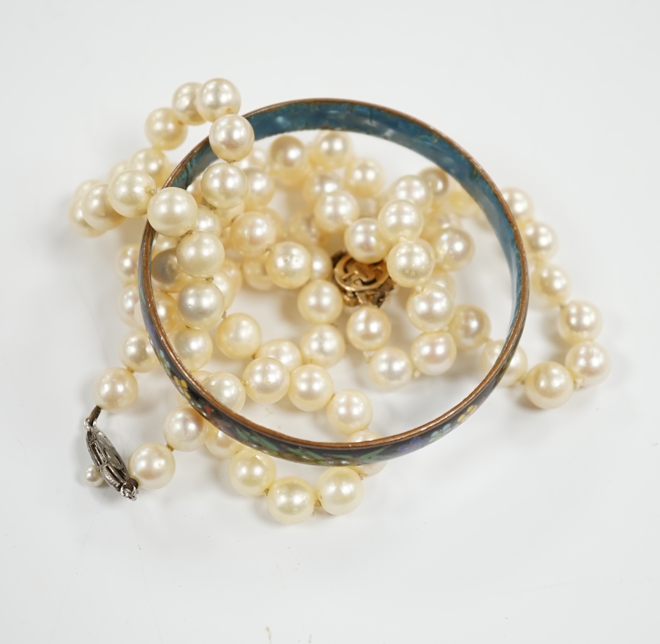 Two single strand cultured pearl necklaces, one with 9ct, white opal and cultured pearl set clasp, 40cm and a cloisonné bangle.